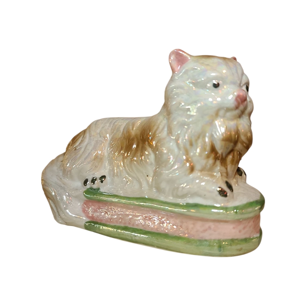 Ceramic Iridescent Cat Sitting on Bed